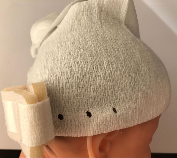 Les chapeaux infantiles de bébé de tissu non-tissé absorbent la sueur pour le casque